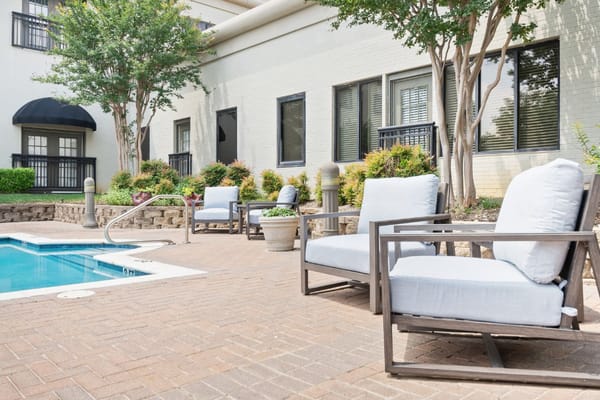 Comfortable seating area by the pool at Parc Place