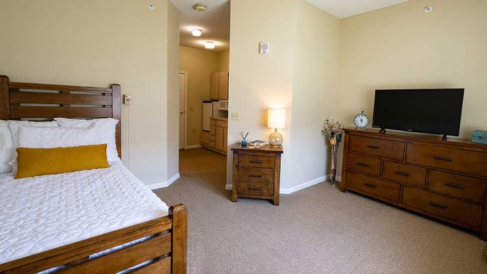 Bright private resident room with furnishings