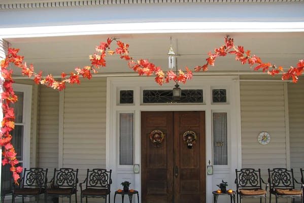 Exterior view of a facility entrance decorated for autumn