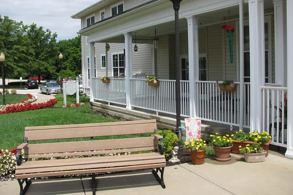 Outdoor seating with flower pots near the facility