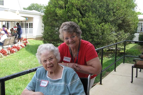 Two residents enjoying time in the garden