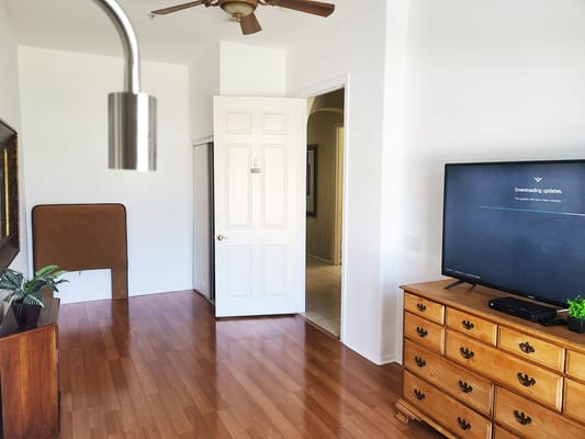 Interior view of a room with a TV and door
