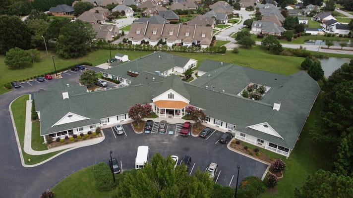 Aerial view of Pee Dee Gardens senior living facility showing building layout and surrounding area.