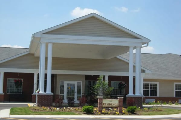 Front entrance of Prairie Lakes Health Campus with a porch and landscaping.