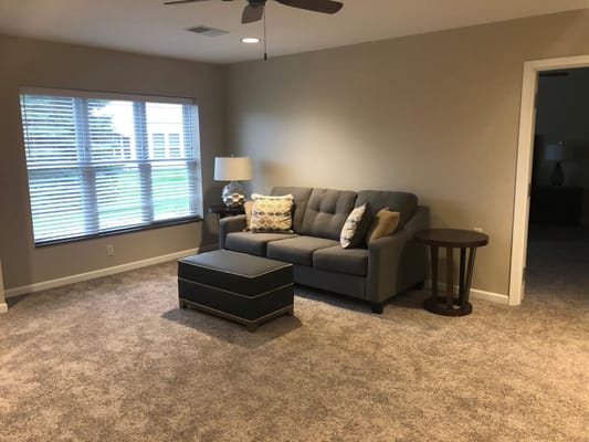 Cozy common area with a couch and lamp