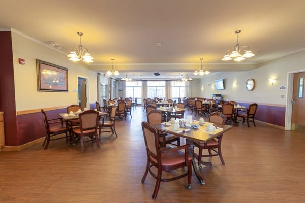Spacious dining room with tables and chairs