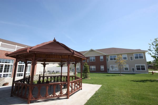 Wooden gazebo in the outdoor area of Prairie Winds of Urbana