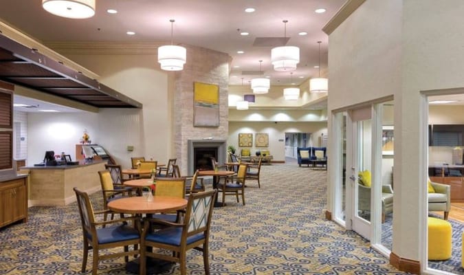 Bright common area with tables and seating