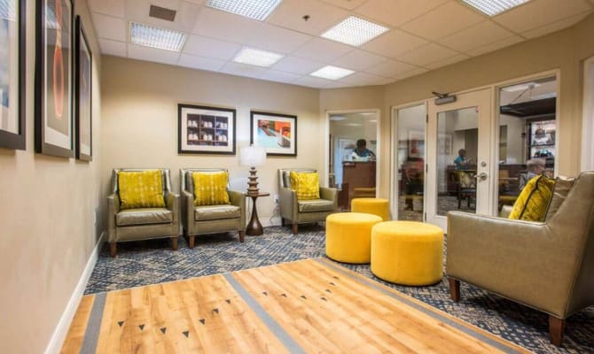 Bright common area with seating and artwork