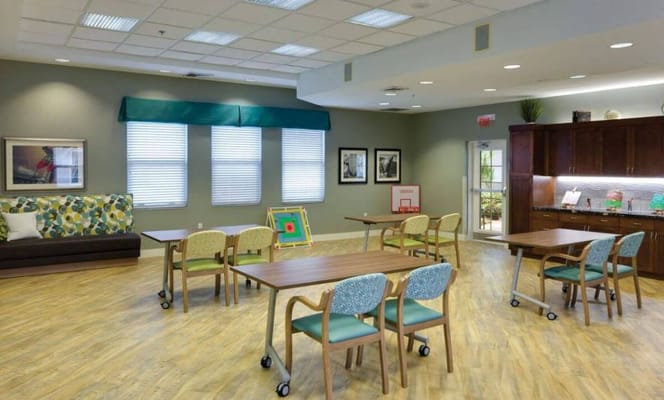 Bright common area with seating and tables