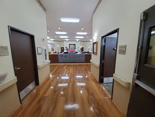 View of the lobby with reception area and polished wooden floors