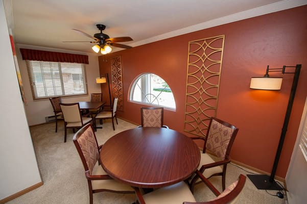 Cozy dining area with round table and comfortable chairs