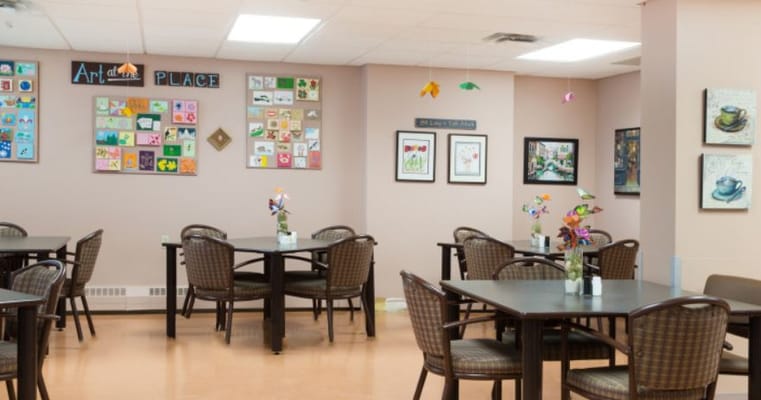 Dining area featuring tables and wall art