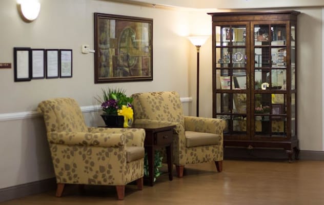 Comfortable seating area in the lobby with a glass display cabinet