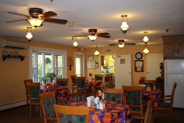 Dining area with tables and decorative lighting