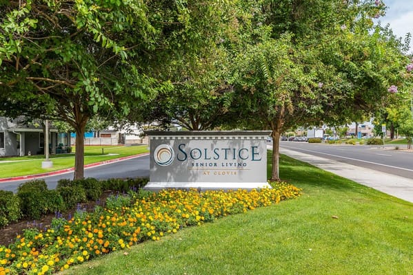 Sign for Solstice Senior Living at Clovis with flowers