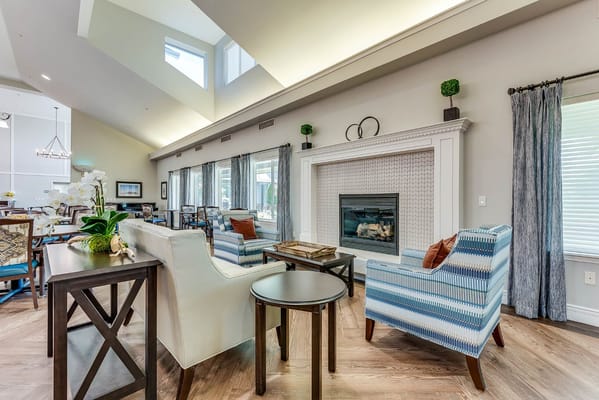 Cozy lounge area with a fireplace and comfortable seating