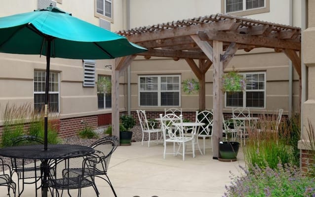 Outdoor seating area with pergola and tables