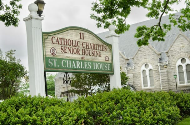 Sign for St. Charles House Apartments at Catholic Charities Senior Housing