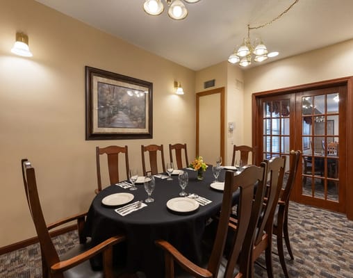 Elegant dining room setup with a round table and chairs