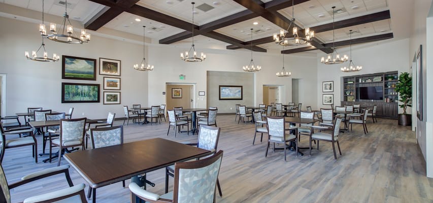 Spacious common area with tables and chairs at Temecula Memory Care.