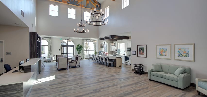 Bright and open lobby area with seating and a reception desk