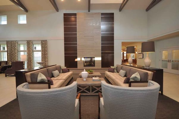 Spacious living room with comfortable seating and fireplace.