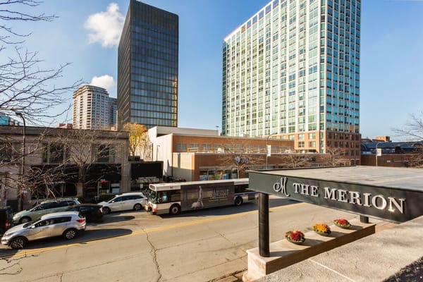 The exterior view of The Merion with surrounding city buildings in Evanston.