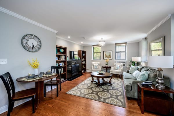 A comfortable living room with a sofa, table, and decorative elements.
