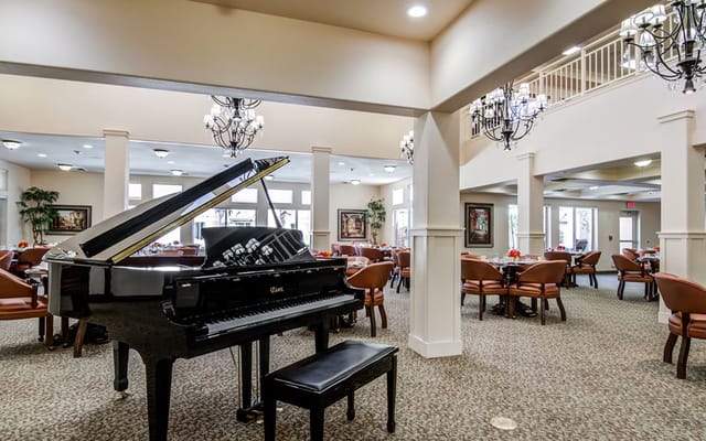 Interior view of the dining area with a grand piano