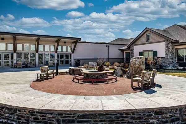 Outdoor seating area with a fire pit at The Peaks at Old Laramie Trail