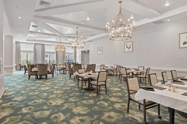 Spacious dining room with tables and chairs in The Preserve at Meridian