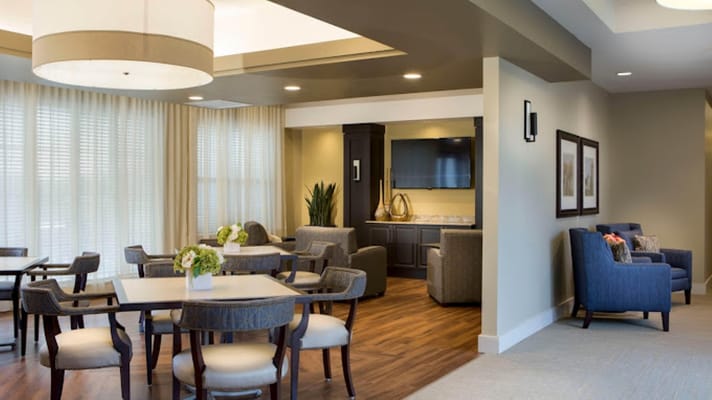 Comfortable common area with seating and dining tables