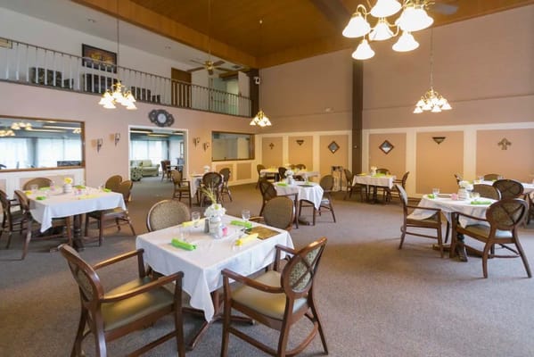 Dining area with neatly set tables and decor