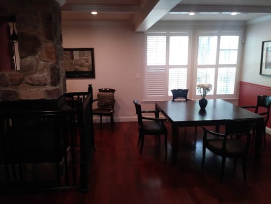 Common area with a table and chairs in an interior space