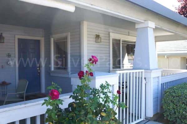 Front entrance with rose bushes at Tuscan Blue Assisted Living II