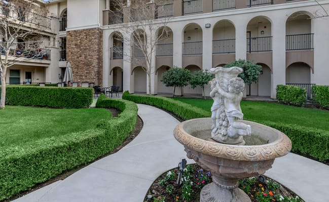 Cherubic fountain in a landscaped courtyard