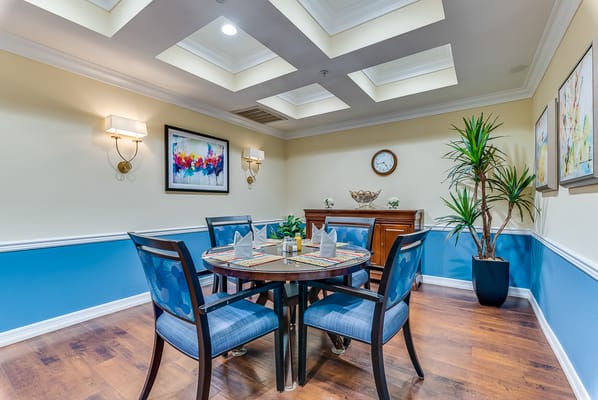 Cozy dining room with a round table set for meals