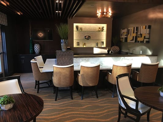 Stylish lounge area with seating and a bar in Vineyard Ranch at Temecula.