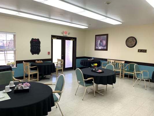 Dining room with tables set for residents