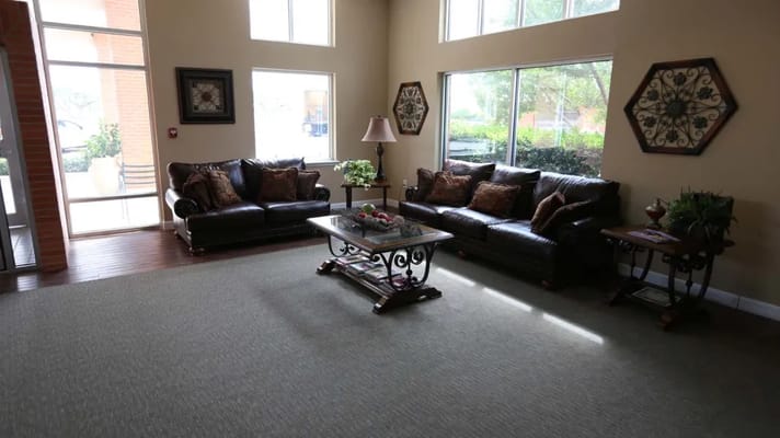 Cozy lobby area with seating and natural light