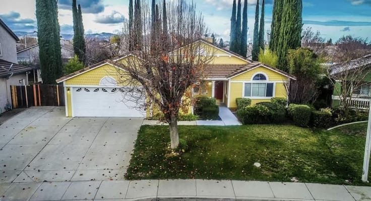 Exterior view of a yellow residential building