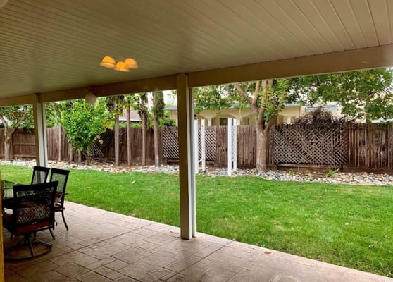 Outdoor patio area with seating and garden