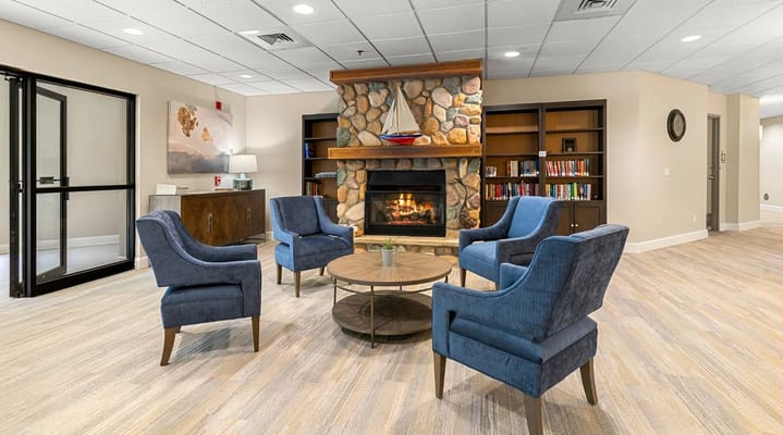 Stylish lounge with armchairs and a stone fireplace