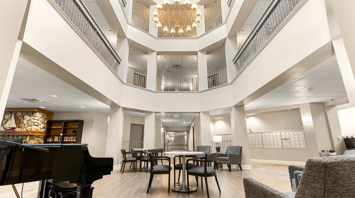 Modern lobby area with seating and a piano