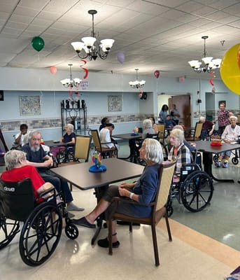 Residents enjoying a celebration in a common area