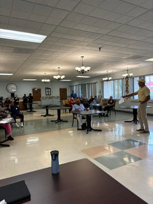 Residents and staff engaged in an activity in a common area