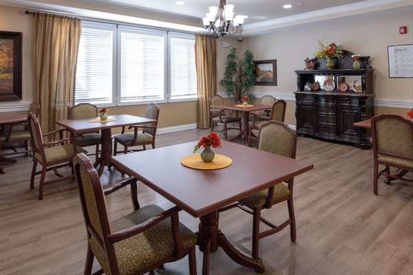 Dining area with tables set for residents
