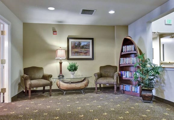 Interior seating area with chairs and a lamp
