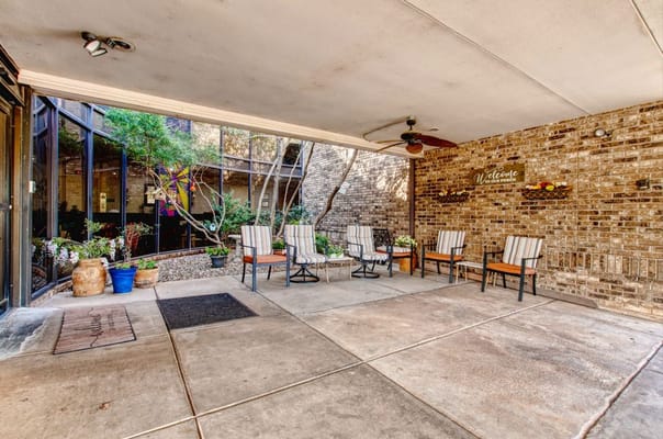 Outdoor seating area with welcoming decor and plants